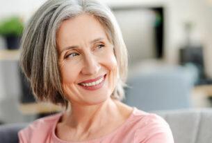 Closeup,Portrait,Smiling,Confident,Senior,Woman,Sitting,On,Comfortable,Sofa