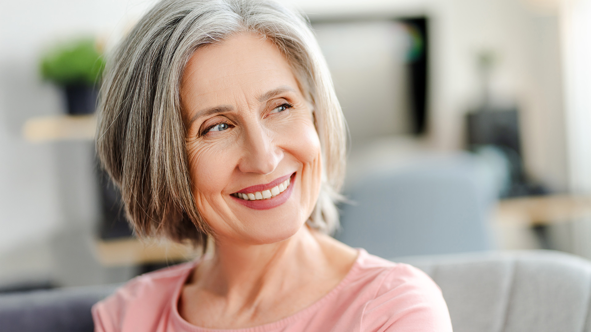 Closeup,Portrait,Smiling,Confident,Senior,Woman,Sitting,On,Comfortable,Sofa
